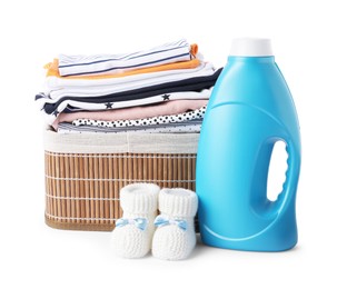 Photo of Bottle with fabric softener, shoes and baby clothes isolated on white