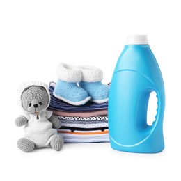 Photo of Bottle with fabric softener, shoes, baby clothes and toy isolated on white