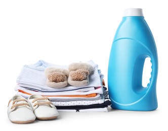 Photo of Bottle with fabric softener, shoes and baby clothes isolated on white