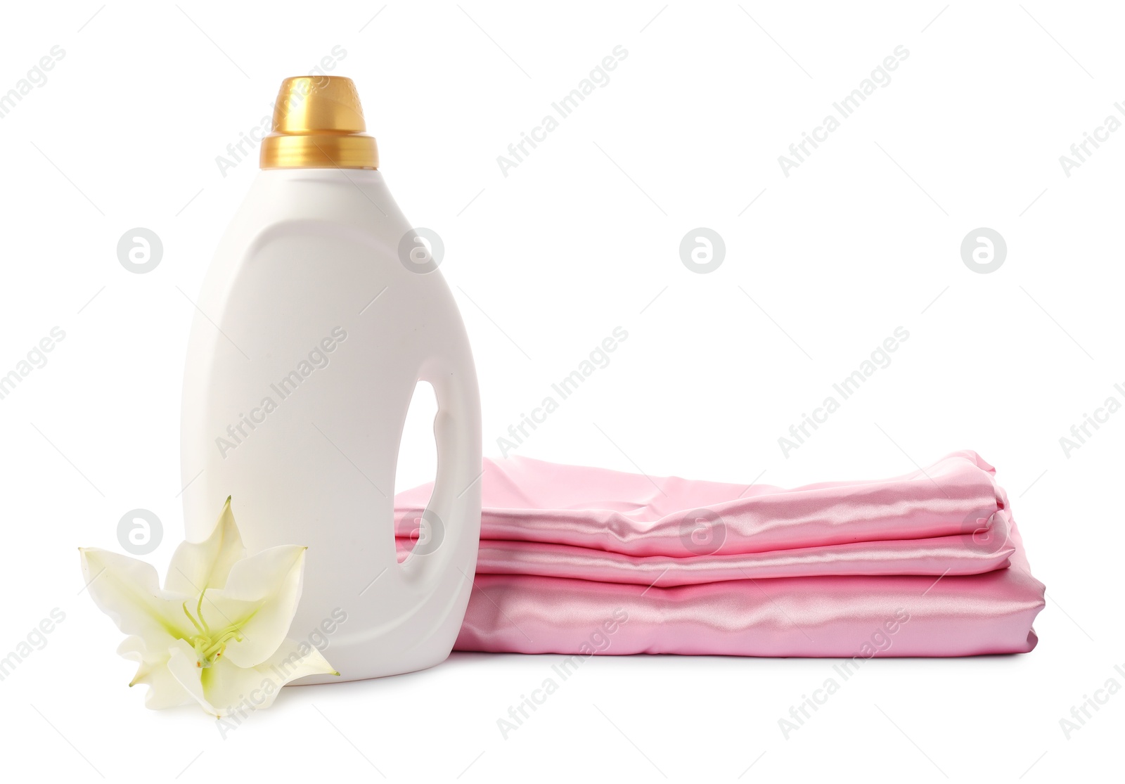Photo of Bottle of fabric softener, stacked clothes and flower isolated on white