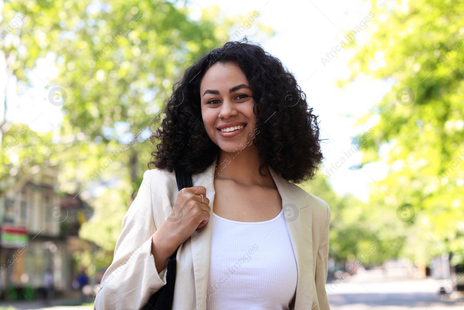 Portrait of smiling Latin American woman outdoors Photo of Portrait of smiling Latin American woman outdoors