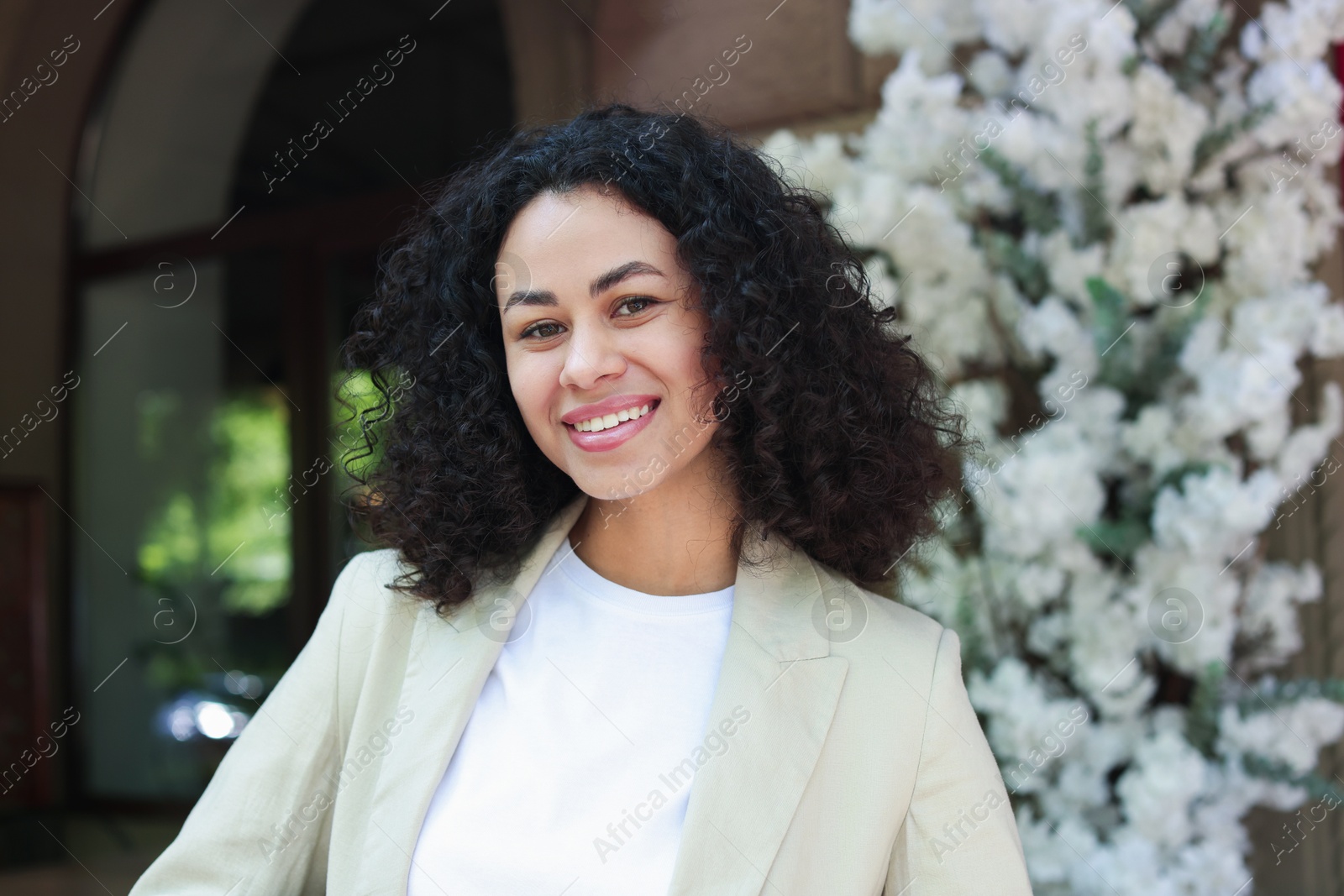 Portrait of smiling Latin American woman outdoors Photo of Portrait of smiling Latin American woman outdoors
