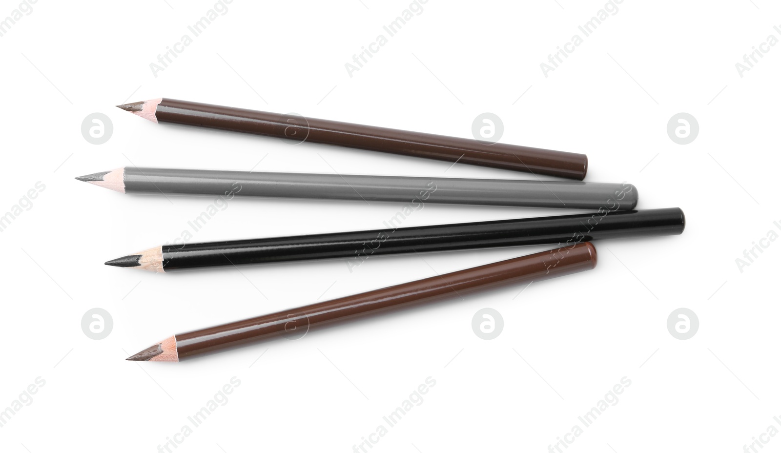 Different eyebrow pencils isolated on white, top view Photo of Different eyebrow pencils isolated on white, top view