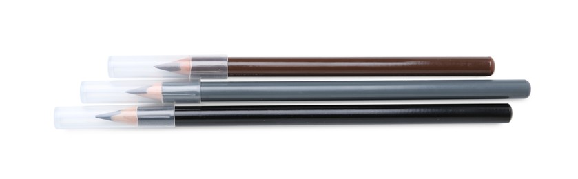 Photo of Different eyebrow pencils isolated on white, top view