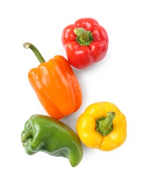 Photo of Ripe colorful bell peppers isolated on white, top view
