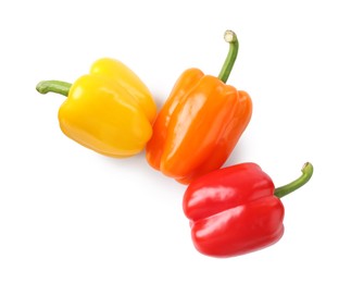Photo of Ripe colorful bell peppers isolated on white, top view