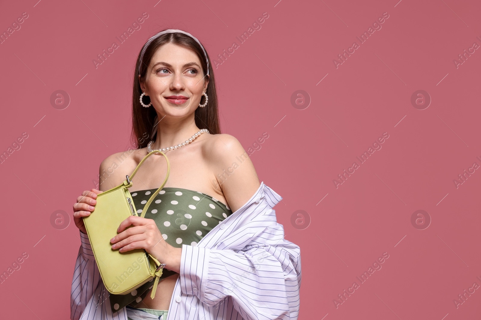 Fashionable portrait of beautiful woman in stylish outfit on pink background. Space for text Photo of Fashionable portrait of beautiful woman in stylish outfit on pink background. Space for text