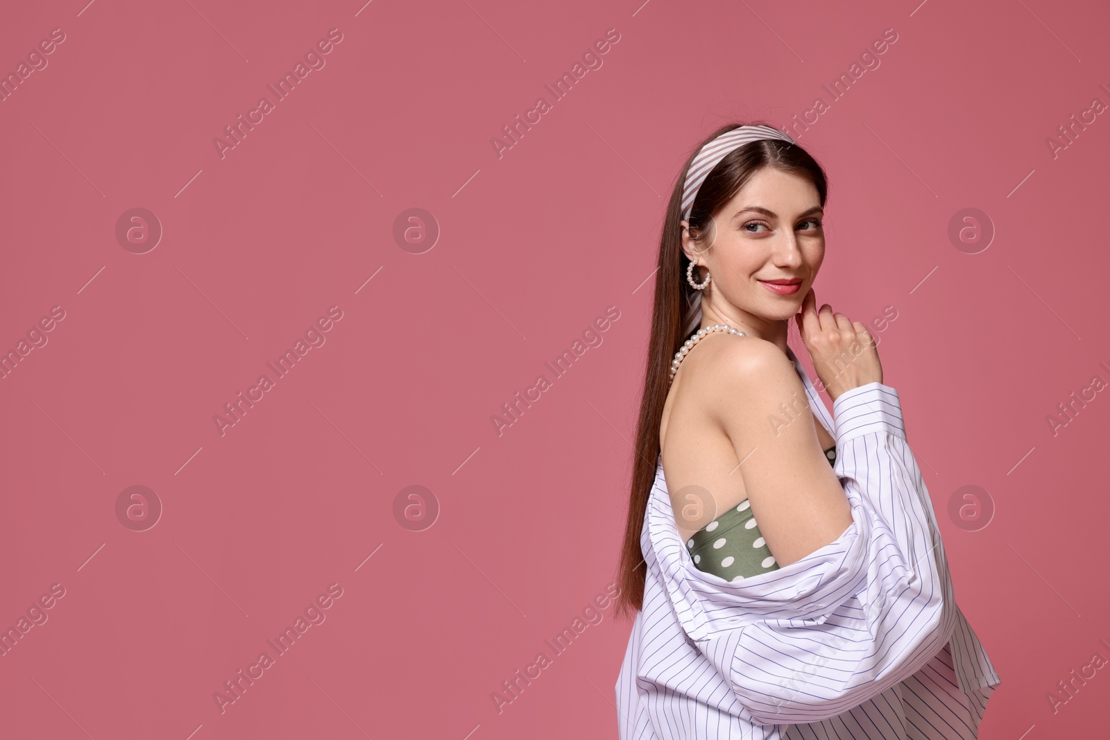Fashionable portrait of beautiful woman in stylish outfit on pink background. Space for text Photo of Fashionable portrait of beautiful woman in stylish outfit on pink background. Space for text