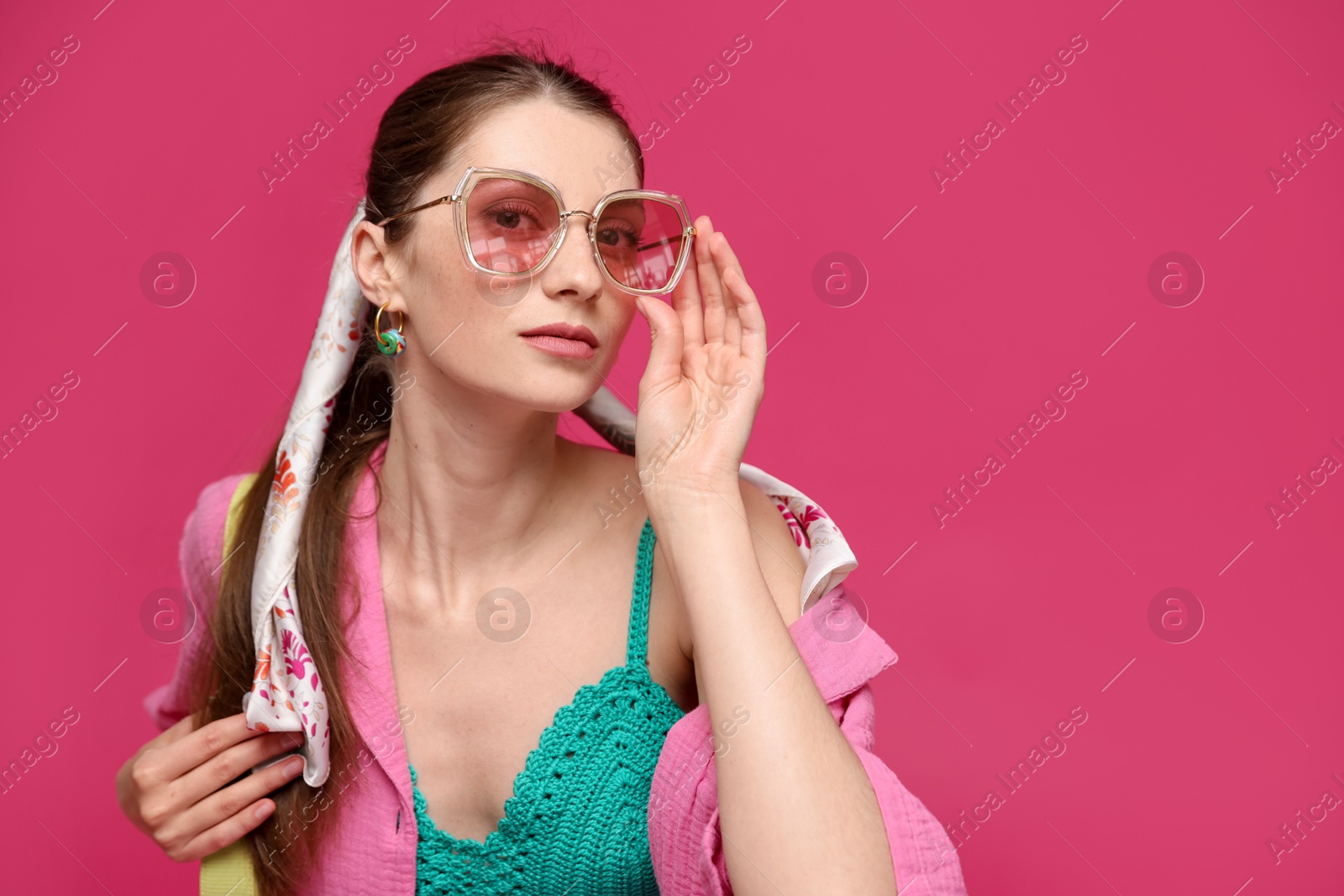 Fashionable portrait of beautiful woman in stylish outfit on pink background. Space for text Photo of Fashionable portrait of beautiful woman in stylish outfit on pink background. Space for text