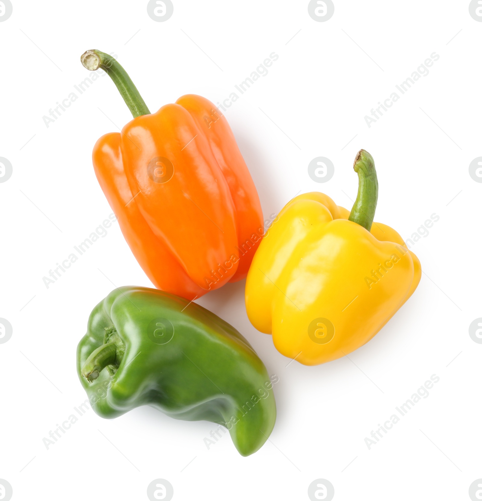 Ripe colorful bell peppers isolated on white, top view Photo of Ripe colorful bell peppers isolated on white, top view