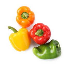 Photo of Ripe colorful bell peppers isolated on white, top view