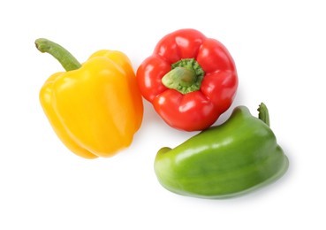Photo of Ripe colorful bell peppers isolated on white, top view