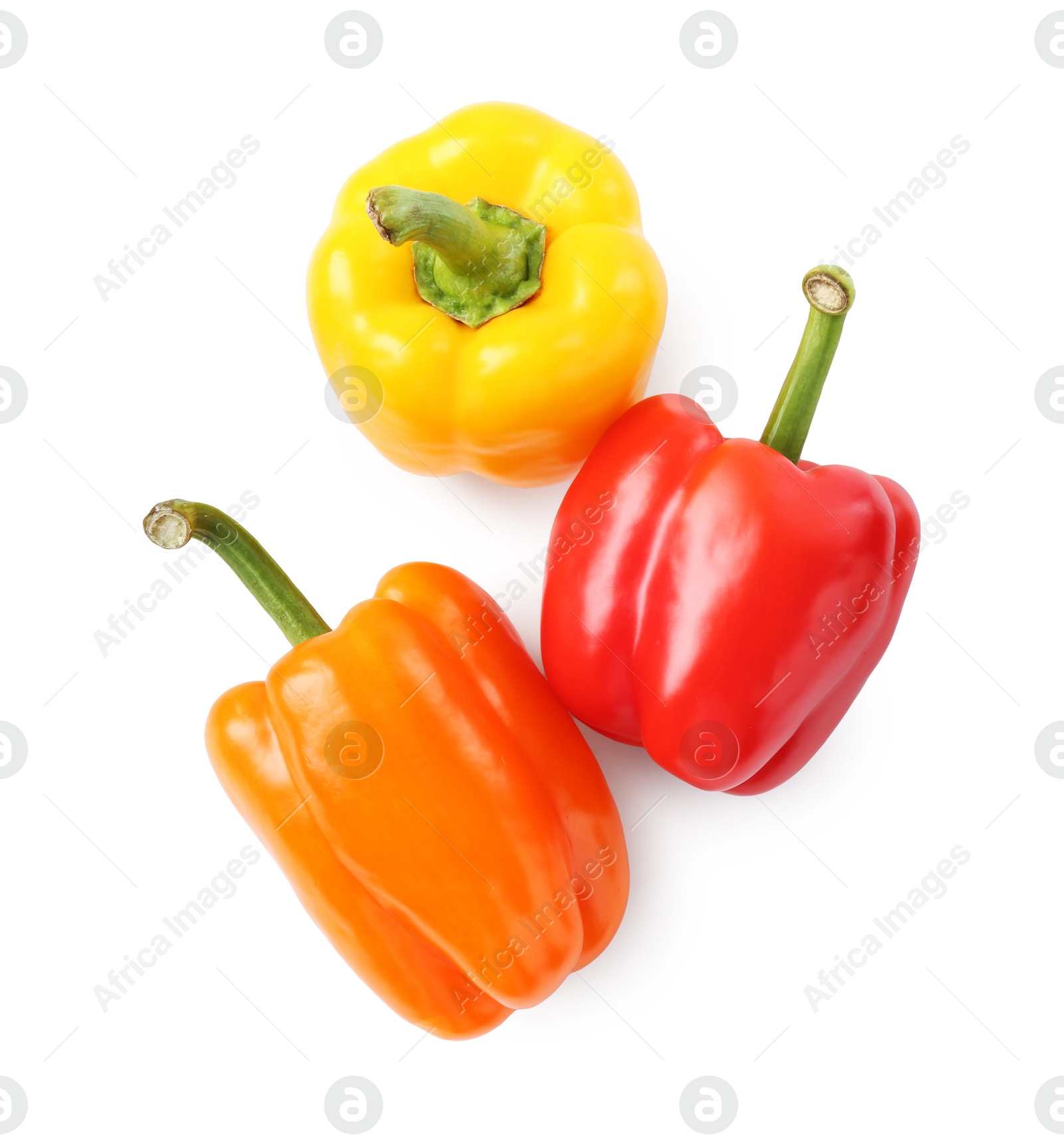 Ripe colorful bell peppers isolated on white, top view Photo of Ripe colorful bell peppers isolated on white, top view
