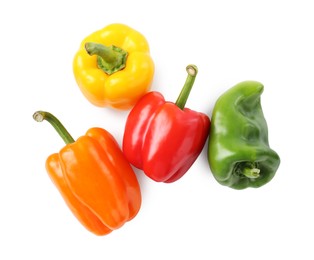Photo of Ripe colorful bell peppers isolated on white, top view