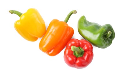 Photo of Ripe colorful bell peppers isolated on white, top view