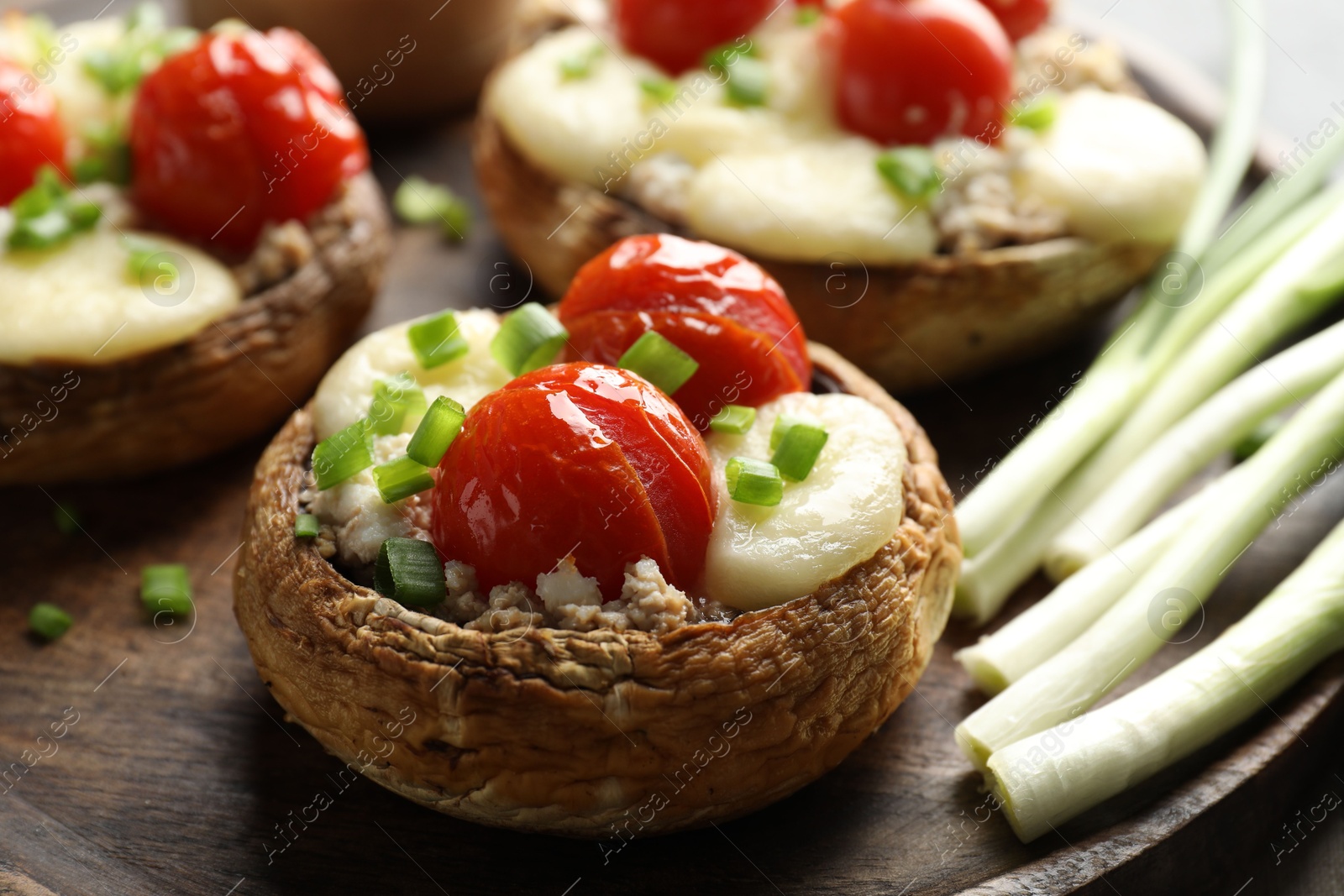 Tasty stuffed mushrooms served on table, closeup Photo of Tasty stuffed mushrooms served on table, closeup