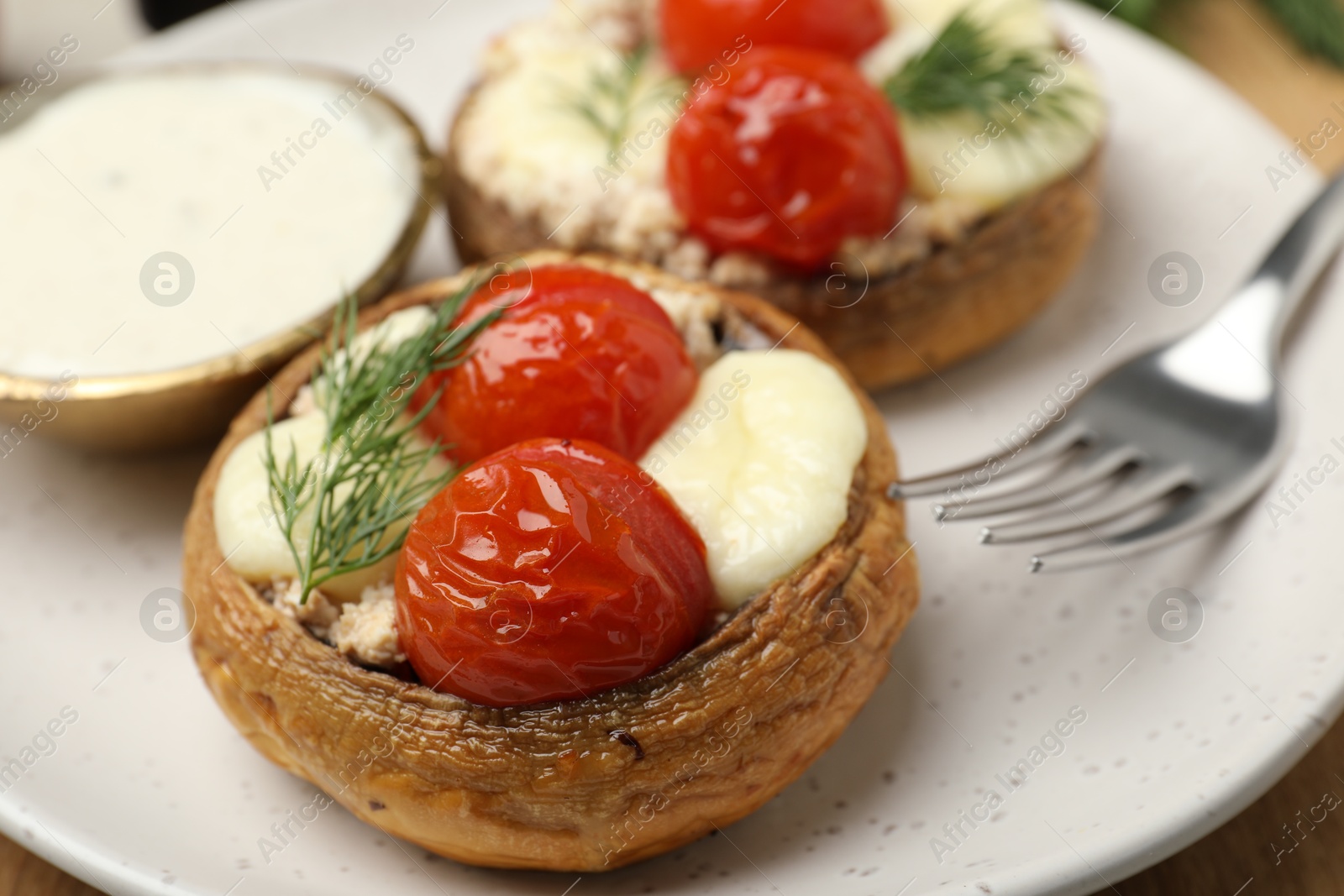 Tasty stuffed mushrooms served on table, closeup Photo of Tasty stuffed mushrooms served on table, closeup