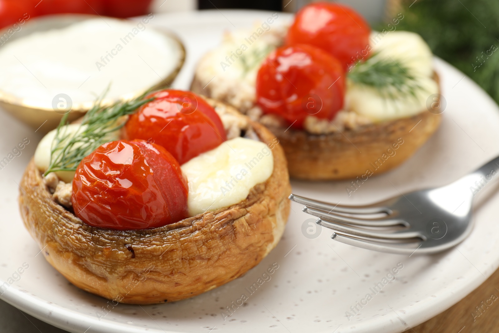 Tasty stuffed mushrooms served on table, closeup Photo of Tasty stuffed mushrooms served on table, closeup
