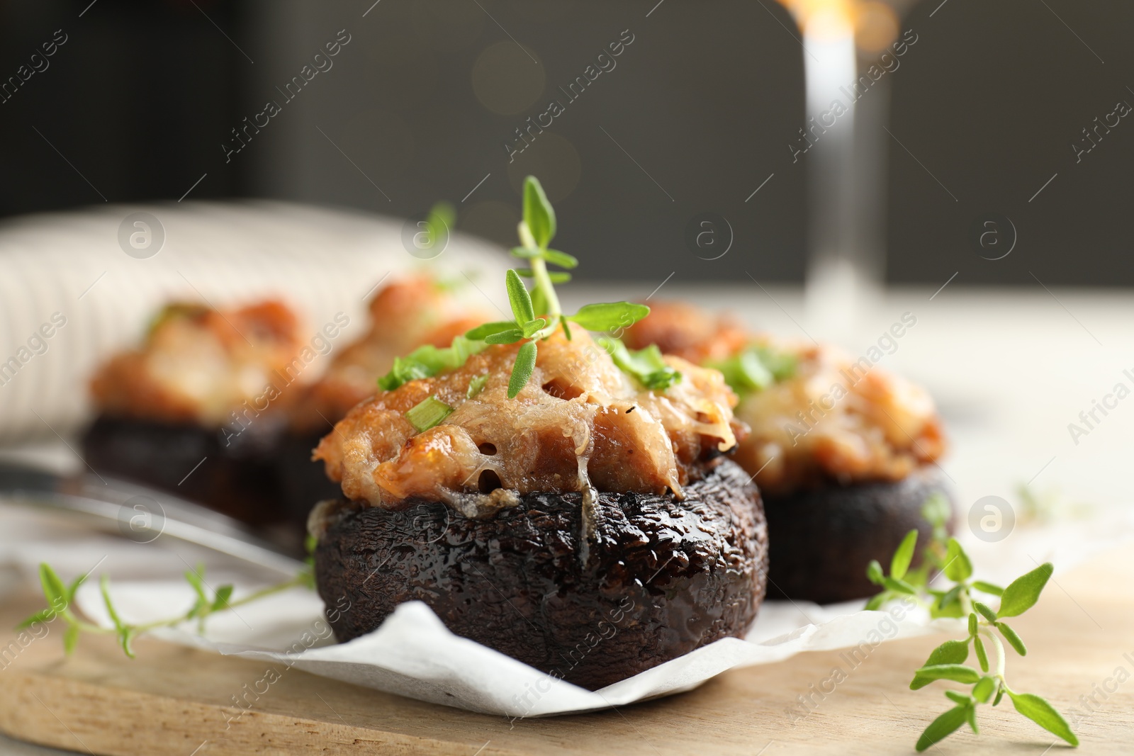 Tasty stuffed mushrooms served on light table against blurred background, closeup Photo of Tasty stuffed mushrooms served on light table against blurred background, closeup