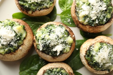 Photo of Tasty stuffed mushrooms served on table, top view