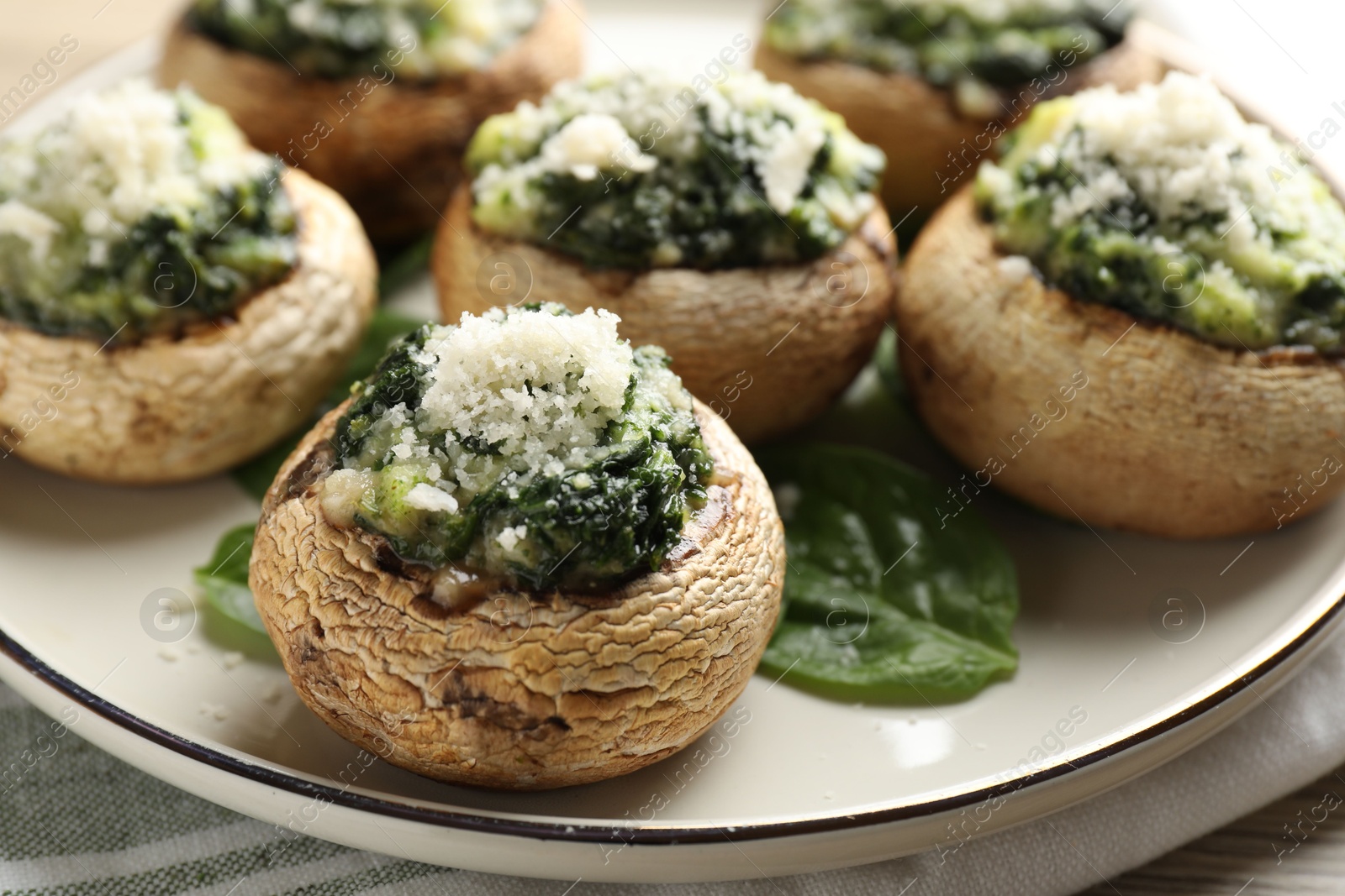 Tasty stuffed mushrooms served on table, closeup Photo of Tasty stuffed mushrooms served on table, closeup