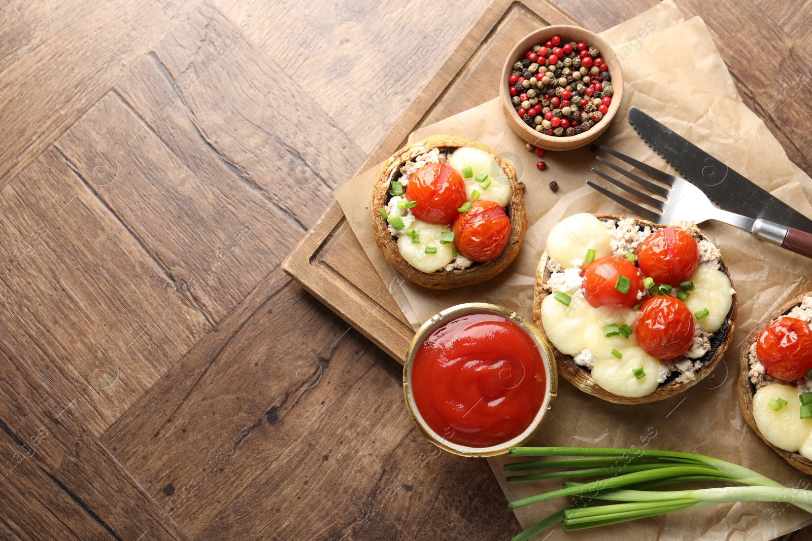Tasty stuffed mushrooms served on wooden table, flat lay. Space for text Photo of Tasty stuffed mushrooms served on wooden table, flat lay. Space for text