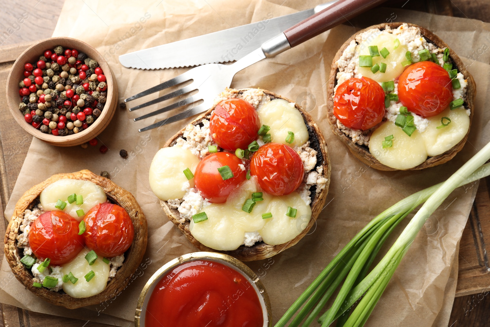 Tasty stuffed mushrooms served on wooden table, flat lay Photo of Tasty stuffed mushrooms served on wooden table, flat lay