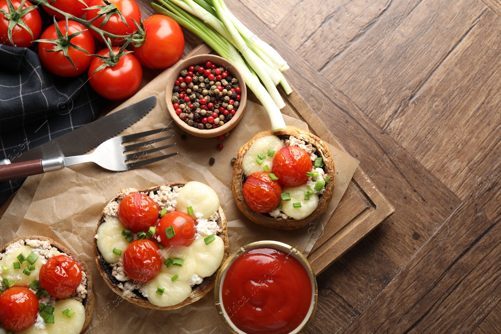 Tasty stuffed mushrooms served on wooden table, flat lay. Space for text Photo of Tasty stuffed mushrooms served on wooden table, flat lay. Space for text