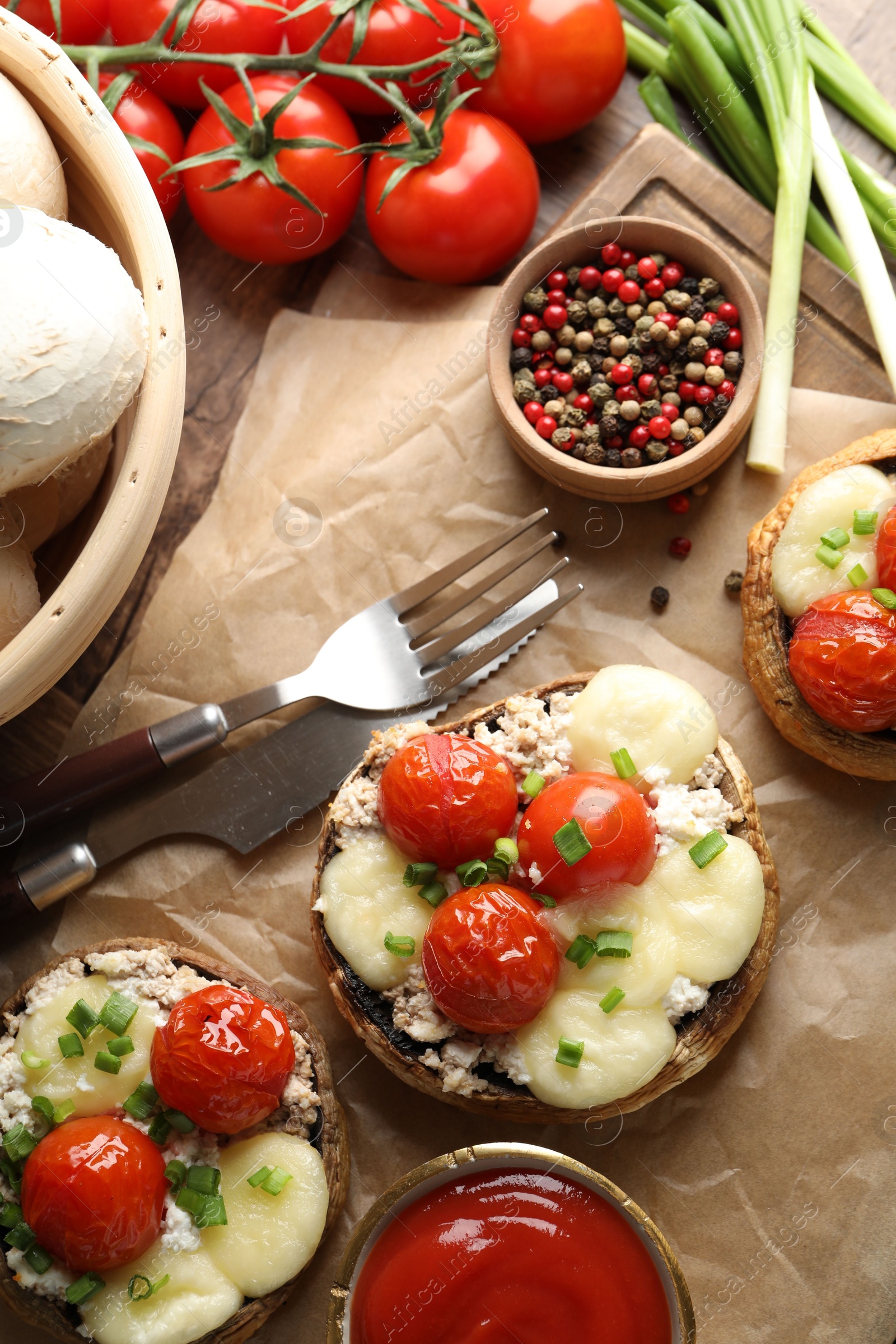 Tasty stuffed mushrooms served on wooden table, flat lay Photo of Tasty stuffed mushrooms served on wooden table, flat lay
