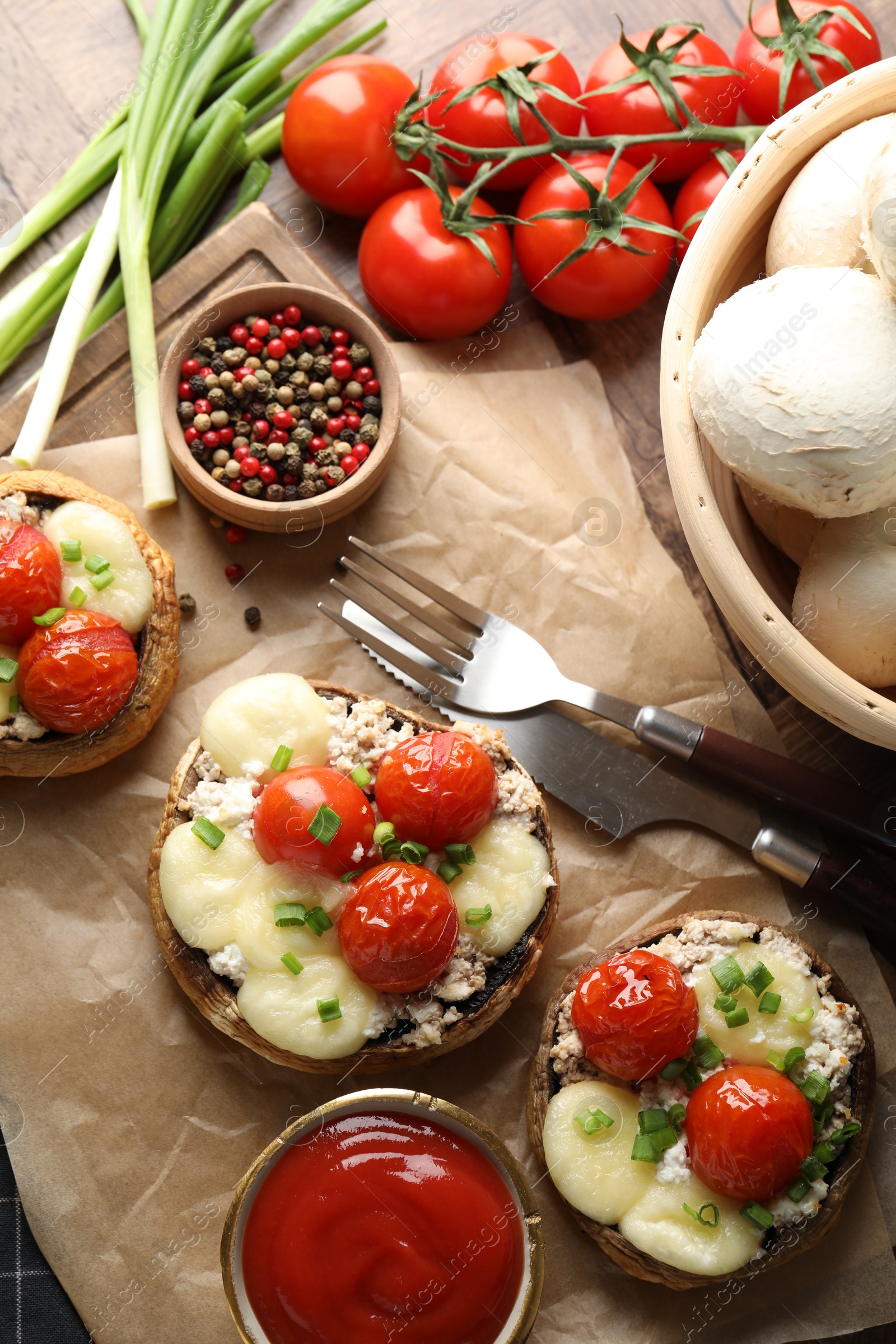 Tasty stuffed mushrooms served on wooden table, flat lay Photo of Tasty stuffed mushrooms served on wooden table, flat lay