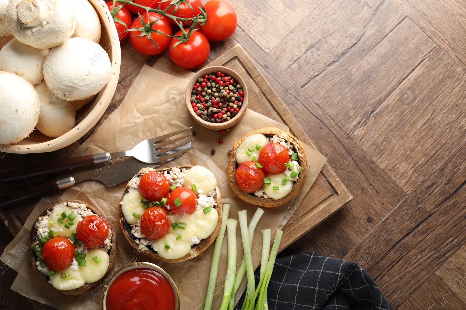 Tasty stuffed mushrooms served on wooden table, flat lay. Space for text Photo of Tasty stuffed mushrooms served on wooden table, flat lay. Space for text