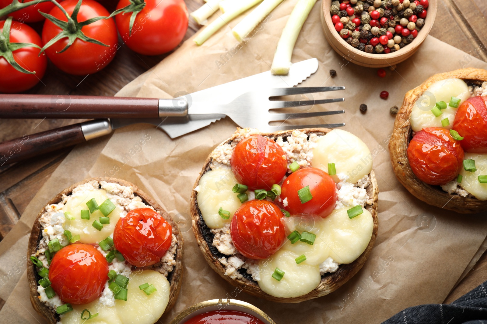 Tasty stuffed mushrooms served on wooden table, flat lay Photo of Tasty stuffed mushrooms served on wooden table, flat lay