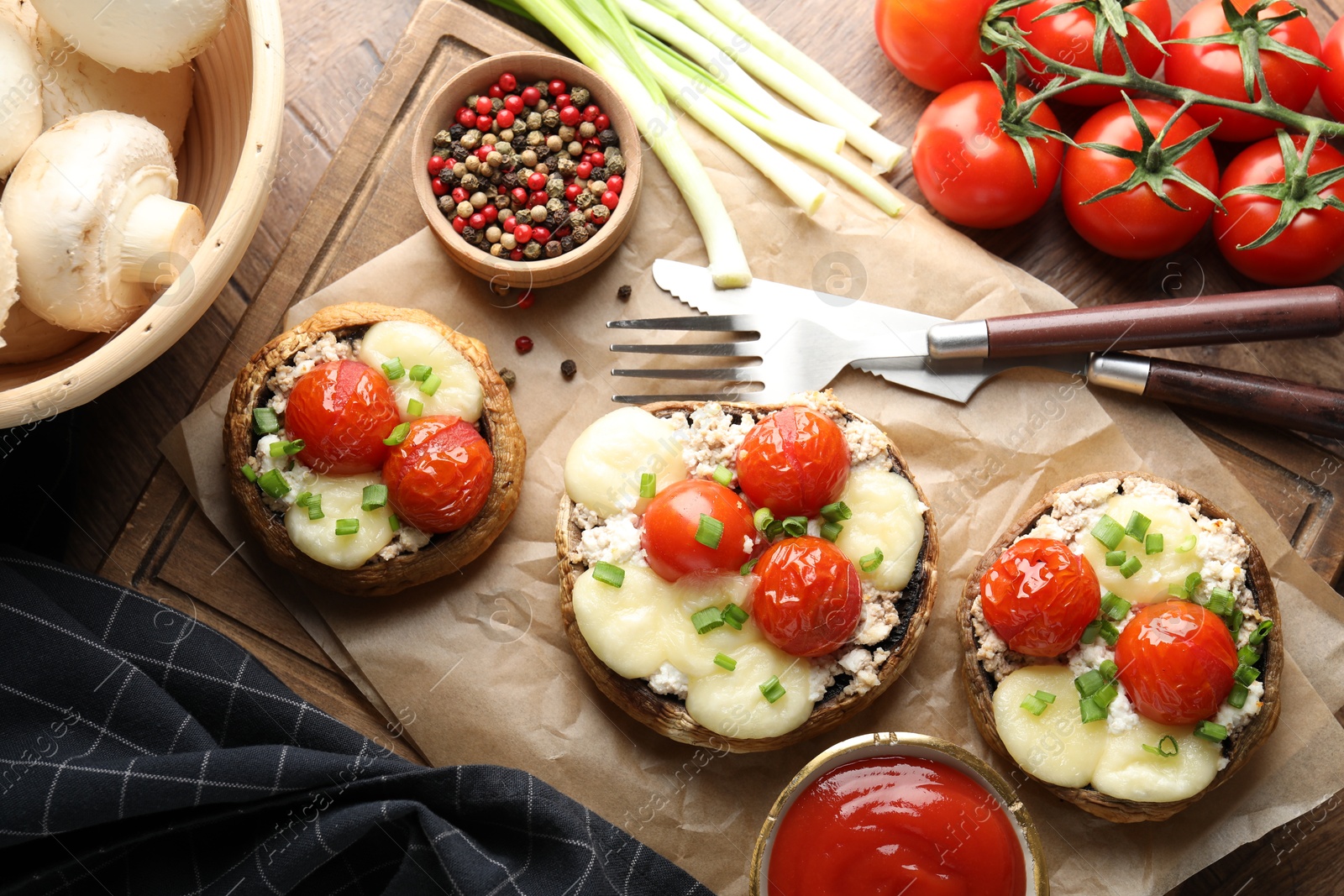 Tasty stuffed mushrooms served on wooden table, flat lay Photo of Tasty stuffed mushrooms served on wooden table, flat lay