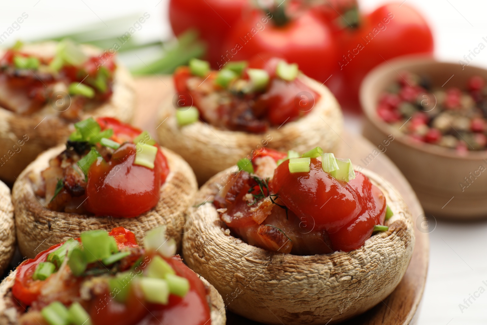 Tasty stuffed mushrooms served on white table, closeup Photo of Tasty stuffed mushrooms served on white table, closeup