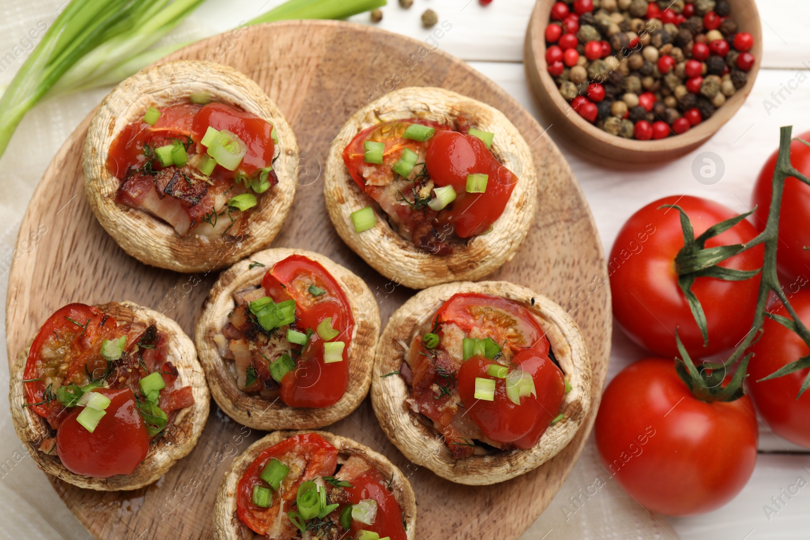 Tasty stuffed mushrooms served on white wooden table, flat lay Photo of Tasty stuffed mushrooms served on white wooden table, flat lay