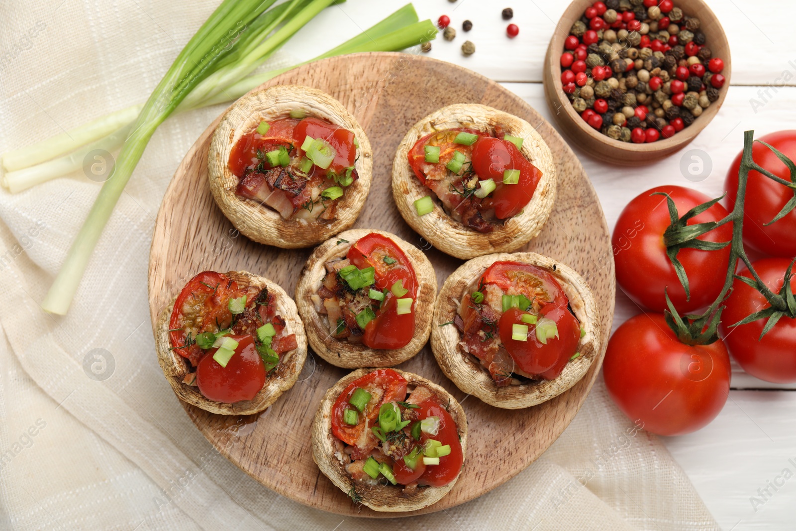Tasty stuffed mushrooms served on white wooden table, flat lay Photo of Tasty stuffed mushrooms served on white wooden table, flat lay