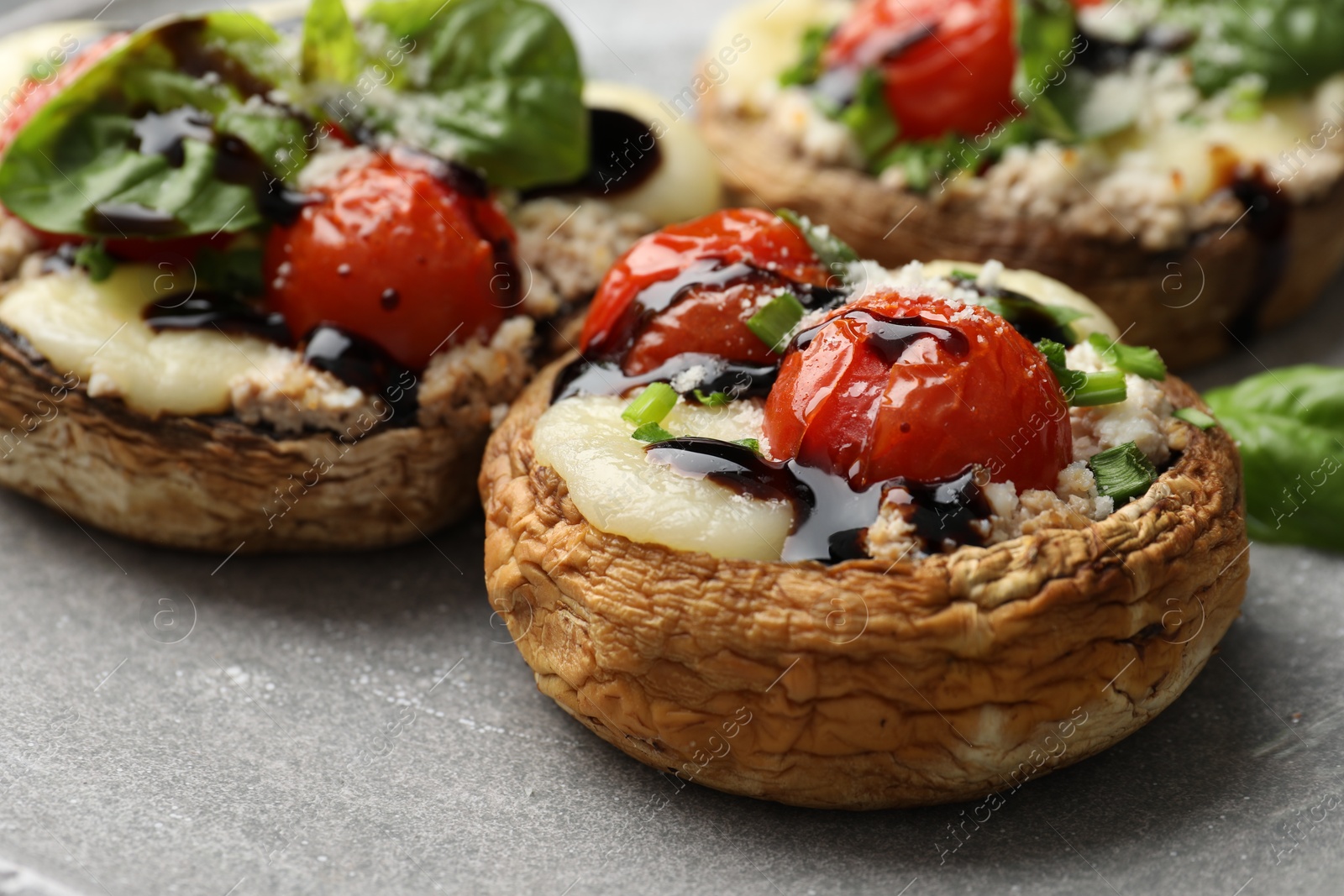 Tasty stuffed mushrooms served on table, closeup Photo of Tasty stuffed mushrooms served on table, closeup