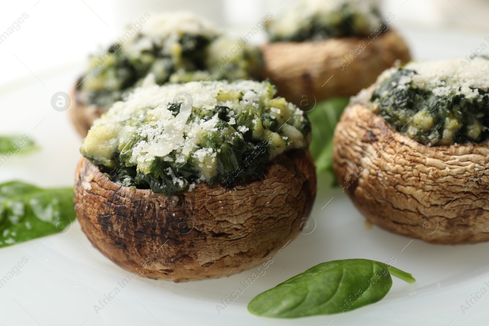Tasty stuffed mushrooms served on table, closeup Photo of Tasty stuffed mushrooms served on table, closeup