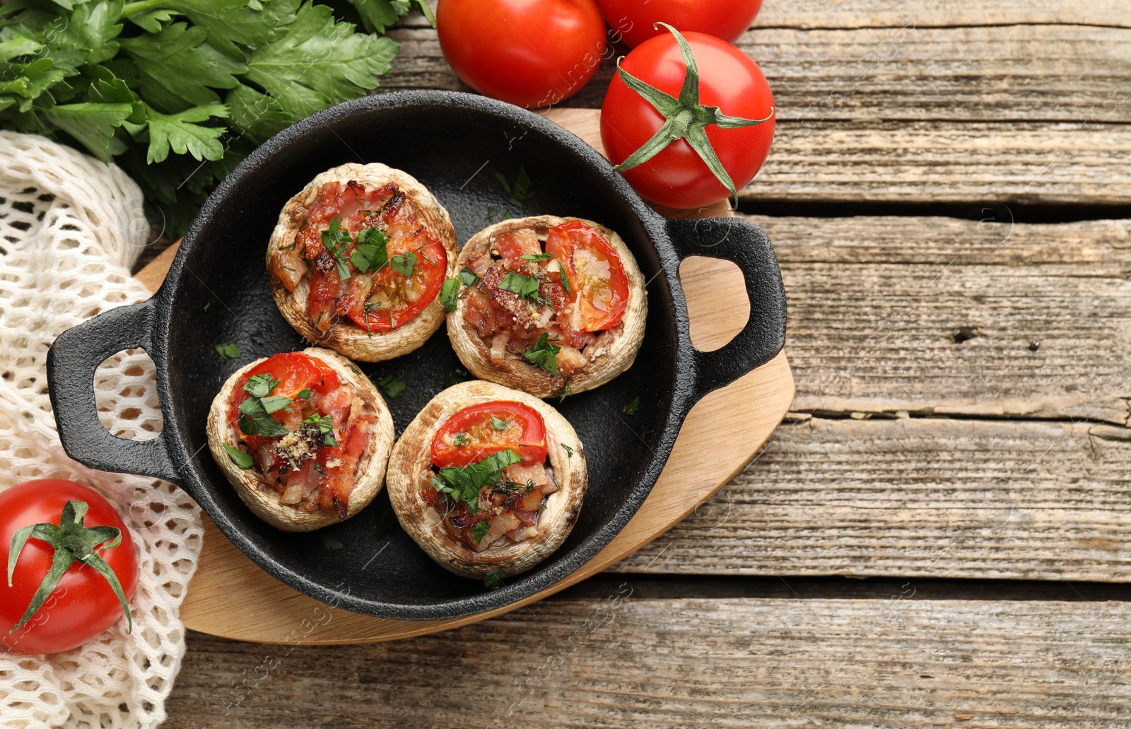 Tasty stuffed mushrooms served on wooden table, flat lay. Space for text Photo of Tasty stuffed mushrooms served on wooden table, flat lay. Space for text