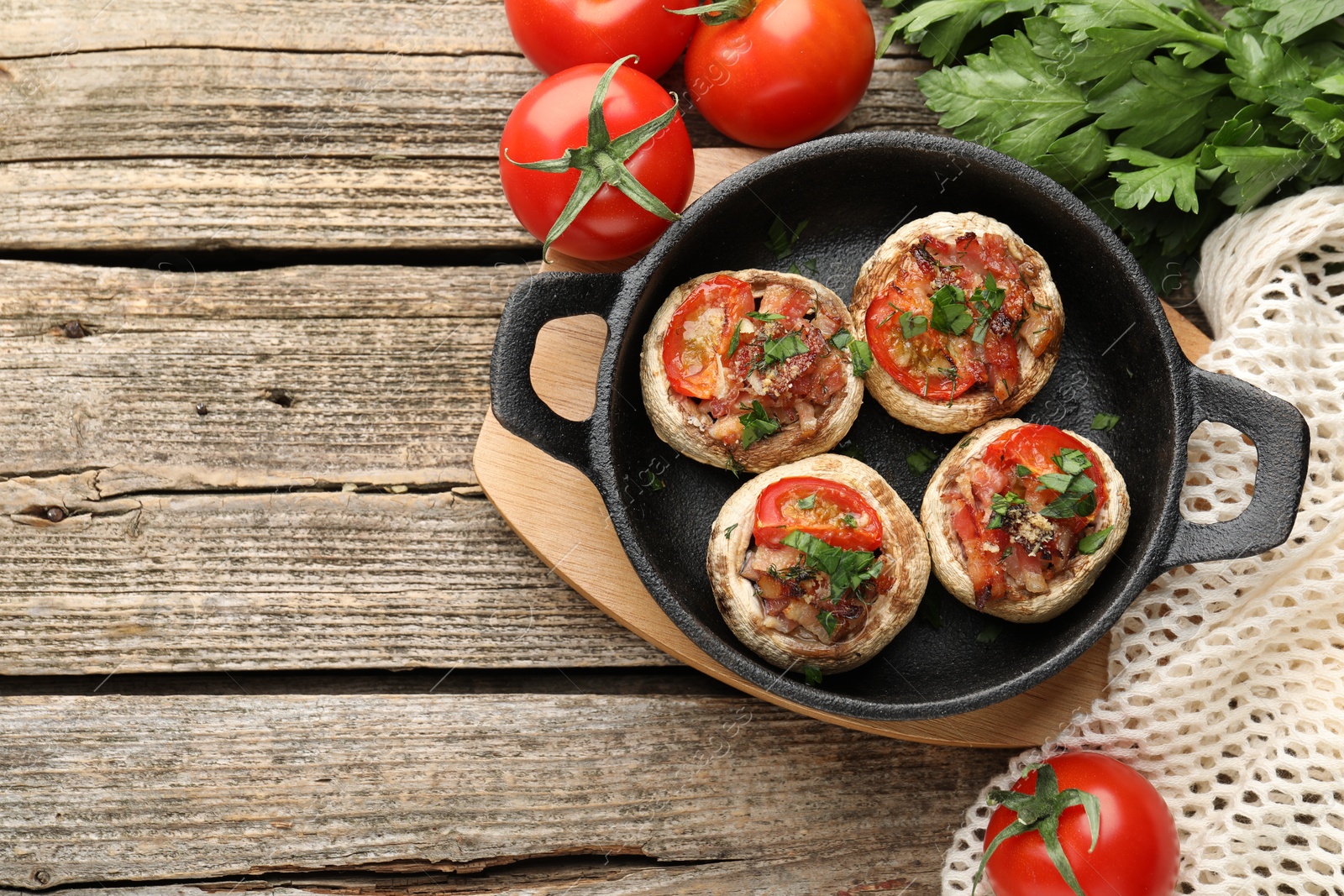 Tasty stuffed mushrooms served on wooden table, flat lay. Space for text Photo of Tasty stuffed mushrooms served on wooden table, flat lay. Space for text