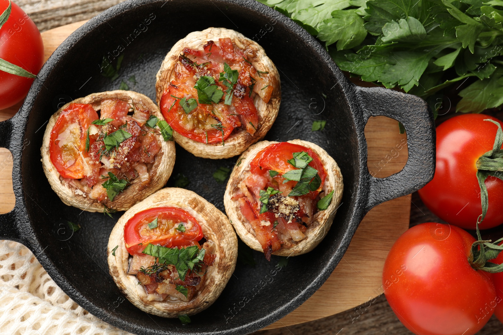 Tasty stuffed mushrooms served on wooden table, flat lay Photo of Tasty stuffed mushrooms served on wooden table, flat lay