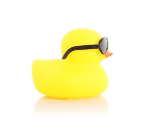 Photo of One cute rubber duck in sunglasses on mirror surface against white background