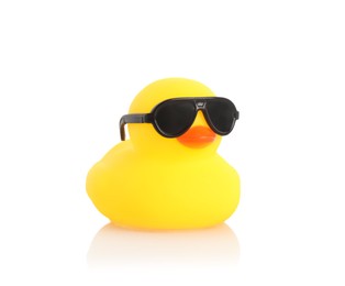 Photo of One cute rubber duck in sunglasses on mirror surface against white background
