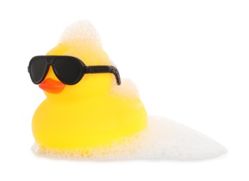 Photo of One cute rubber duck in sunglasses and foam isolated on white