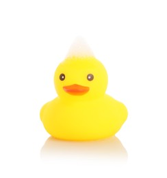 Photo of One cute rubber duck and foam on mirror surface against white background