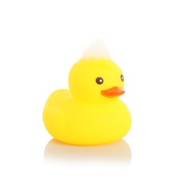 Photo of One cute rubber duck and foam on mirror surface against white background