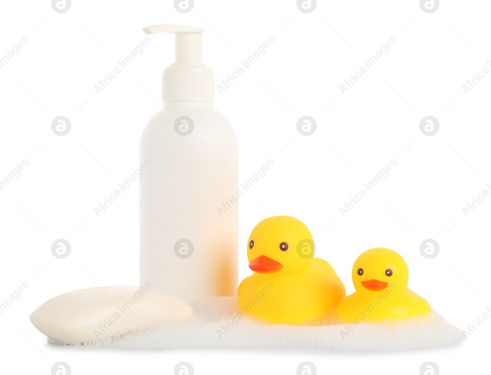 Cute rubber ducks, soap bar, bottle and foam isolated on white Photo of Cute rubber ducks, soap bar, bottle and foam isolated on white