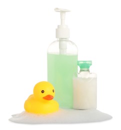 Photo of Cute rubber duck, soap bar, bottle and foam isolated on white