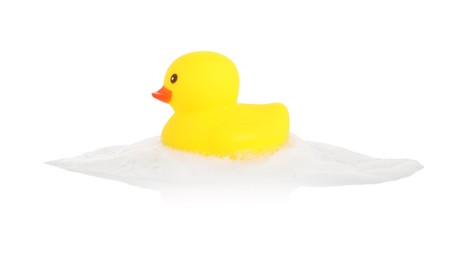 Photo of One cute rubber duck and foam isolated on white