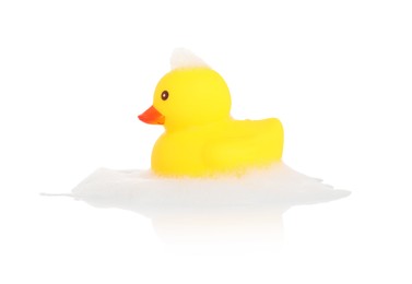 Photo of One cute rubber duck and foam on mirror surface against white background